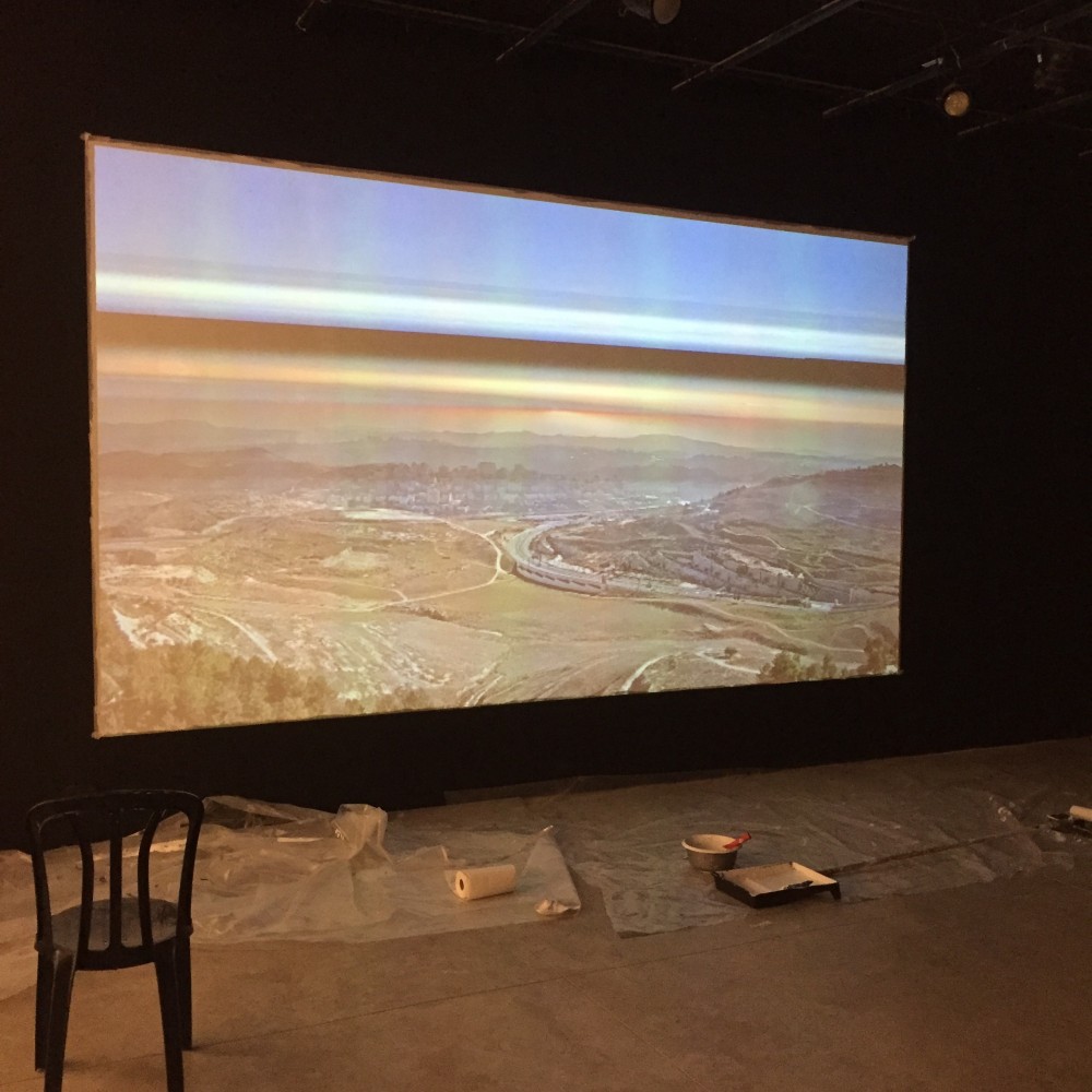 LAND projection being installed at Tel Aviv Artists' Studios Gallery